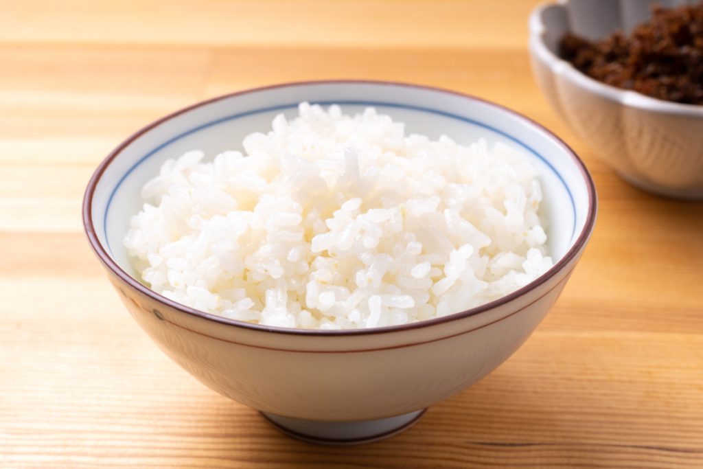 bowl of white rice. is rice bad for dogs?