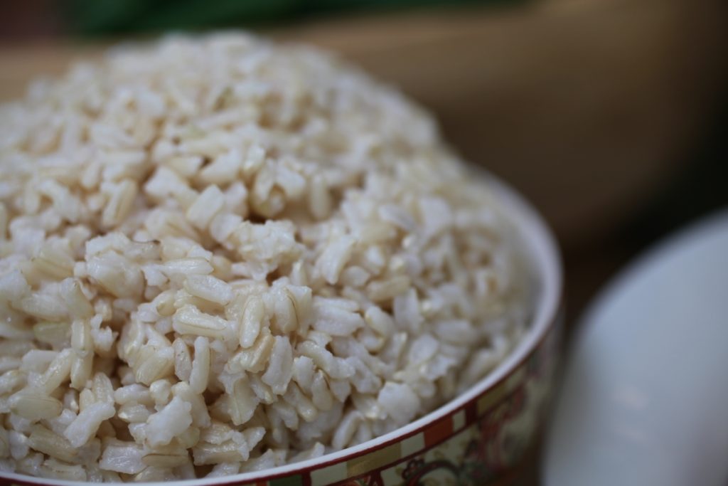 bowl of brown rice. is rice bad for dogs?